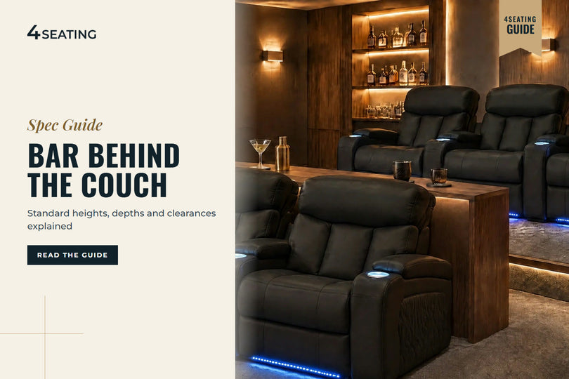 Raised back row of black leather Seatcraft theater recliners behind a walnut drink ledge, with a front row in front, in a home theater
