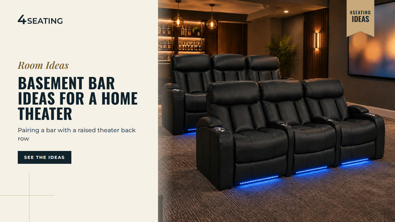 Two rows of black leather Seatcraft theater recliners with blue base lights in a basement theater with a home bar behind